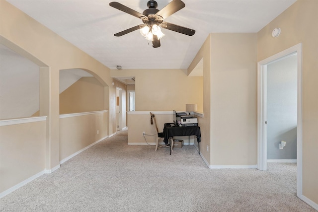 home office featuring ceiling fan and light colored carpet