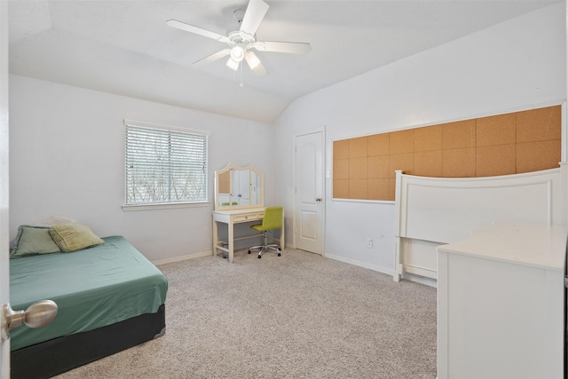 carpeted bedroom featuring ceiling fan and lofted ceiling