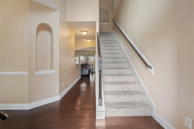 staircase featuring hardwood / wood-style floors