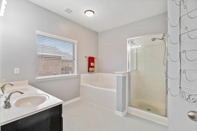 bathroom featuring vanity and shower with separate bathtub