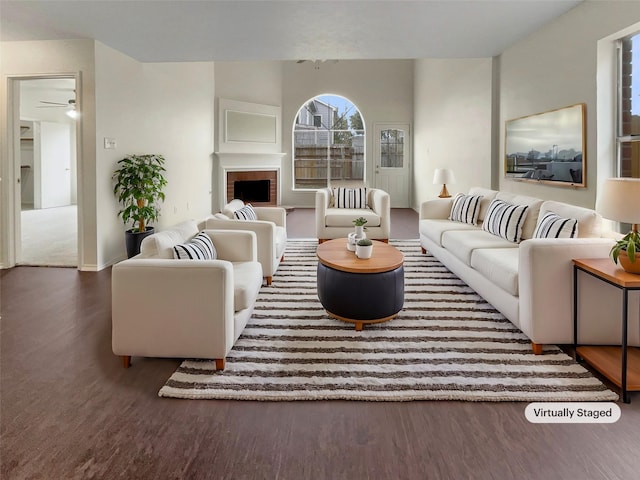 living room featuring a fireplace and dark hardwood / wood-style flooring