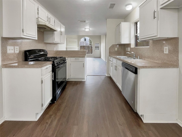 kitchen featuring black gas range oven, white cabinetry, stainless steel dishwasher, and sink