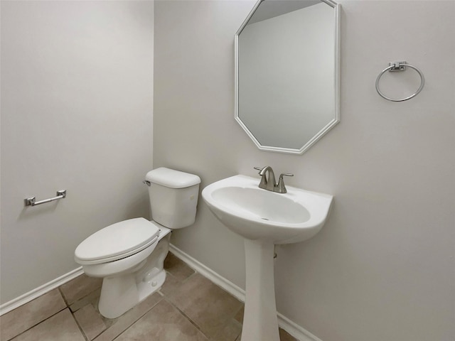 bathroom featuring toilet and tile patterned flooring