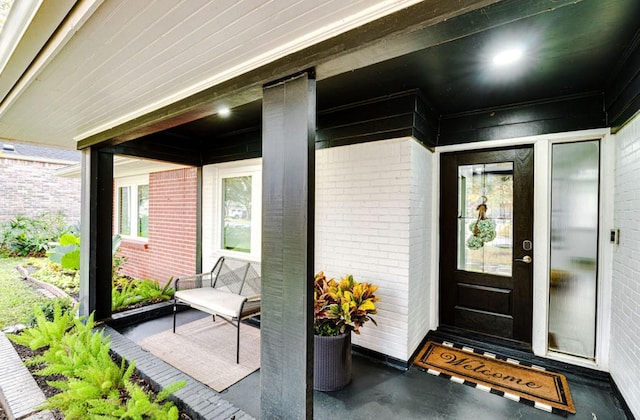 8614 Linkpass Ln, Houston, TX 77025 - doorway to property featuring brick siding
