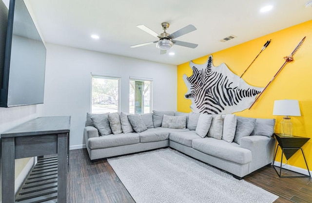 living room with ceiling fan and dark hardwood / wood-style floors