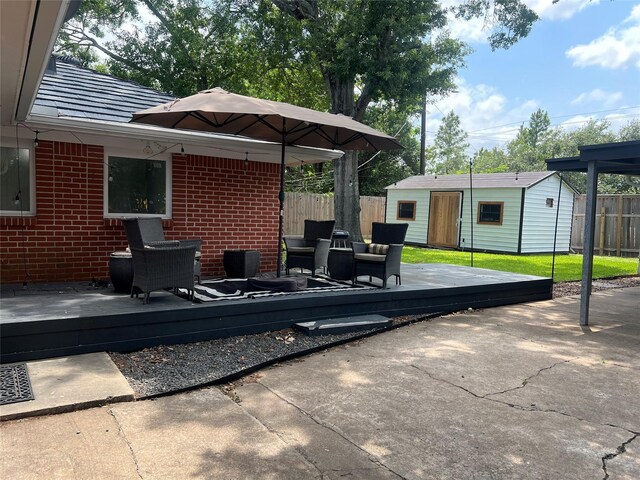 8614 Linkpass Ln, Houston, TX 77025 - view of patio / terrace featuring a wooden deck and an outbuilding