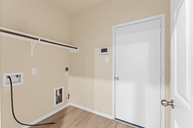 laundry area featuring hookup for a gas dryer, washer hookup, hookup for an electric dryer, and light hardwood / wood-style flooring