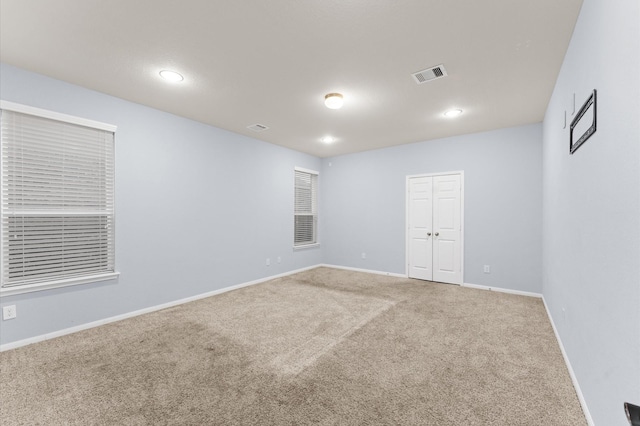 view of carpeted spare room