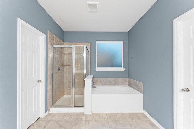 bathroom featuring tile patterned floors and plus walk in shower