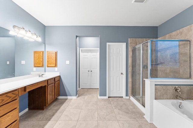 bathroom with tile patterned floors, separate shower and tub, and vanity