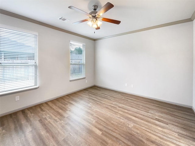 unfurnished room with light hardwood / wood-style floors, ceiling fan, and ornamental molding