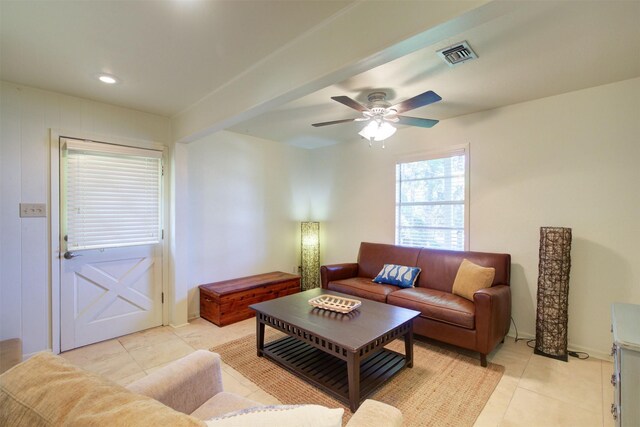 tiled living room featuring ceiling fan