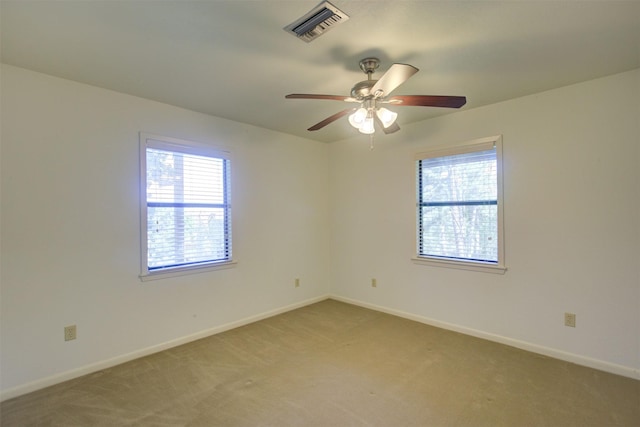 carpeted empty room with ceiling fan