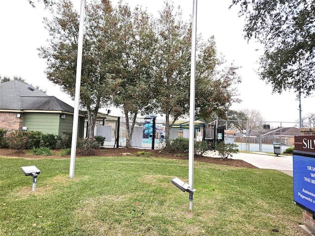 exterior space with a playground and a front yard