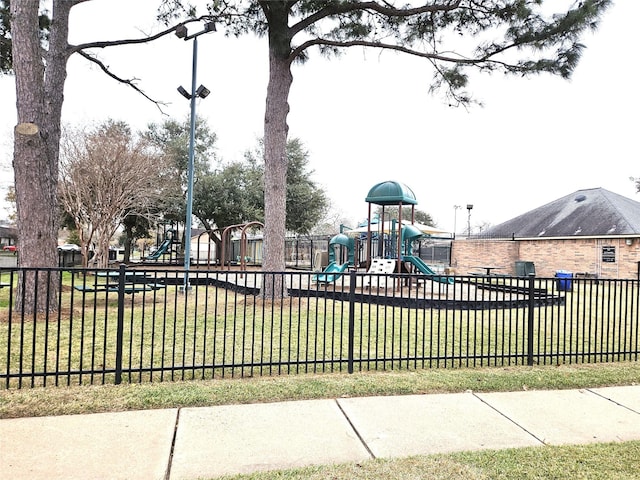 view of jungle gym with a lawn