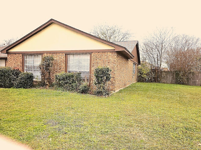 view of property exterior featuring a lawn