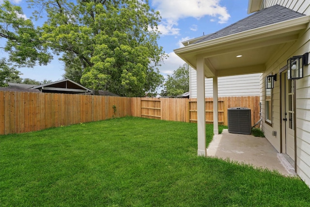 view of yard featuring a patio area and central AC