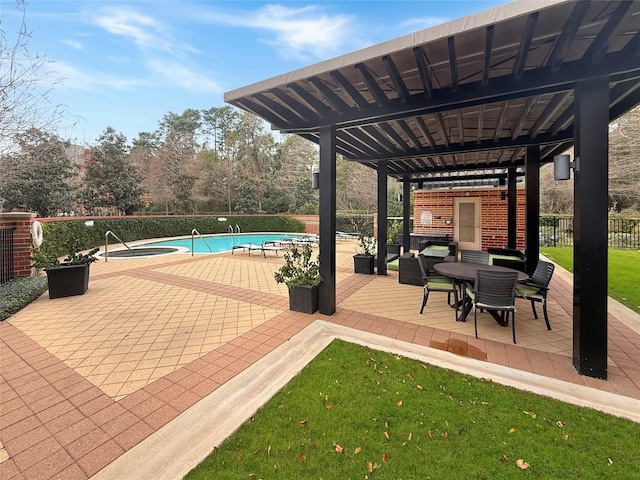 view of patio / terrace featuring a community pool and a pergola