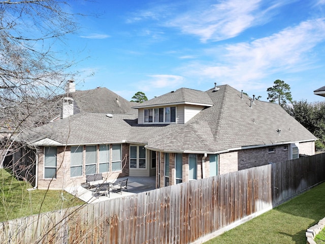 back of property featuring a patio