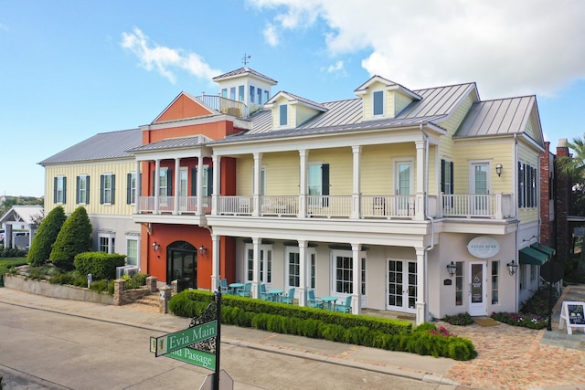 view of front of home featuring a balcony