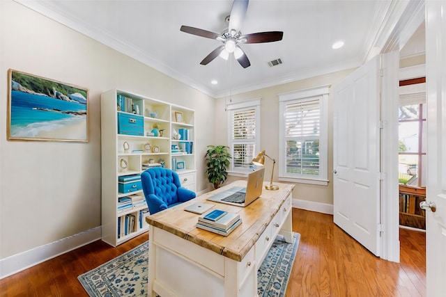 office space with ceiling fan, ornamental molding, and hardwood / wood-style floors