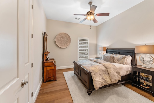 bedroom with light wood-type flooring and ceiling fan