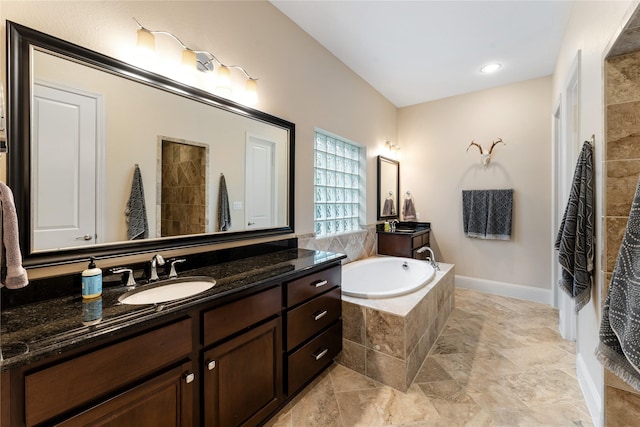 bathroom with a shower and vanity