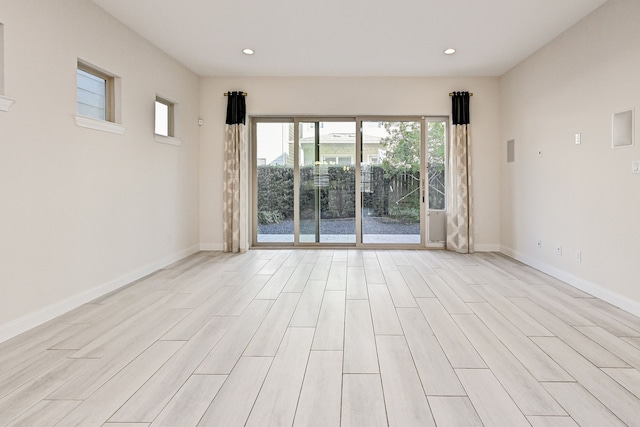 unfurnished room featuring light wood-type flooring