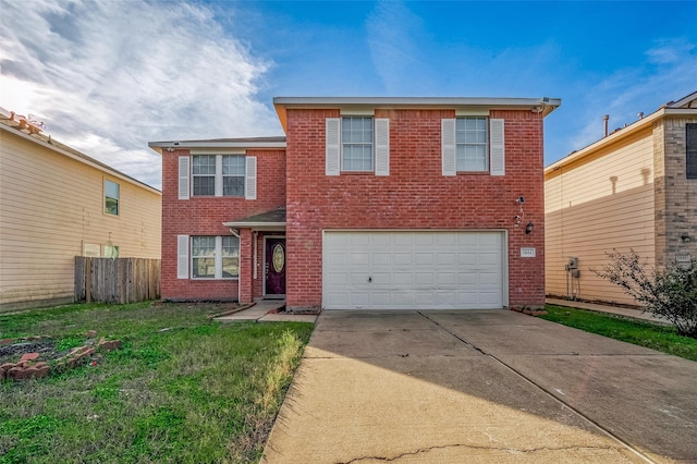 view of front property featuring a garage and a front lawn