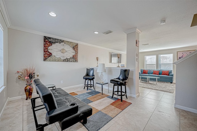 interior space with light tile patterned floors, ornamental molding, and decorative columns