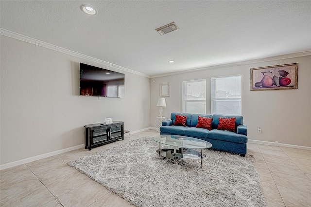 living room with a textured ceiling, light tile patterned flooring, and crown molding