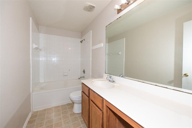 full bathroom featuring toilet, vanity, and tiled shower / bath combo