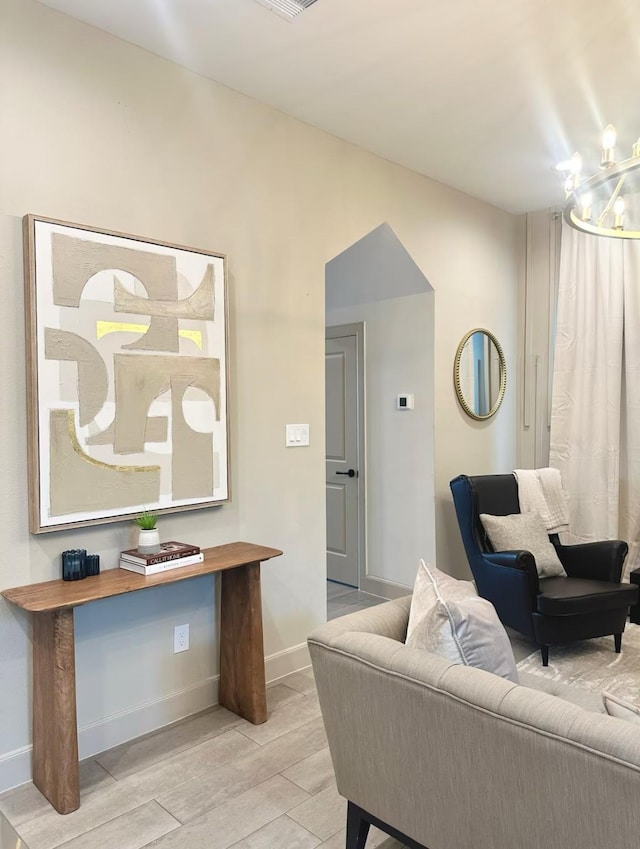 living room with a notable chandelier