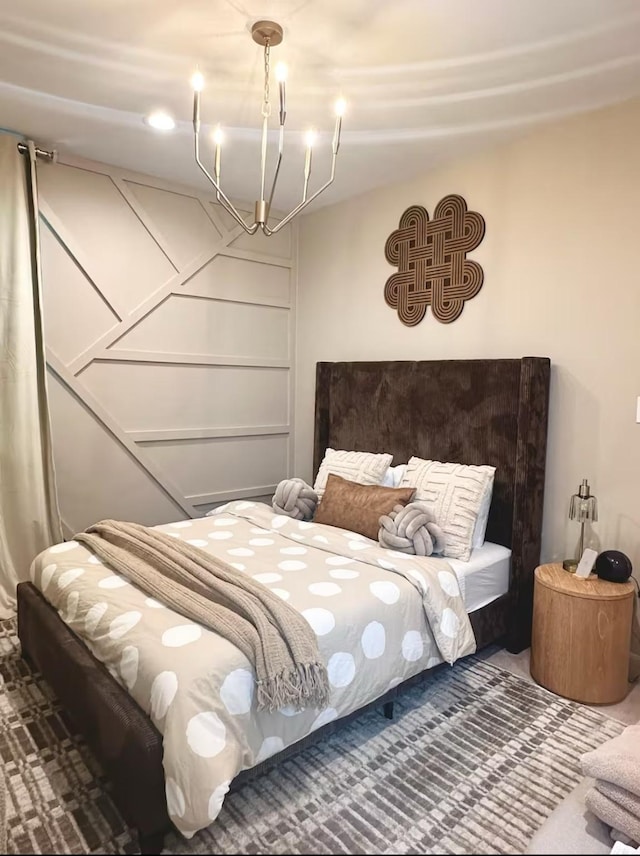 bedroom featuring a notable chandelier