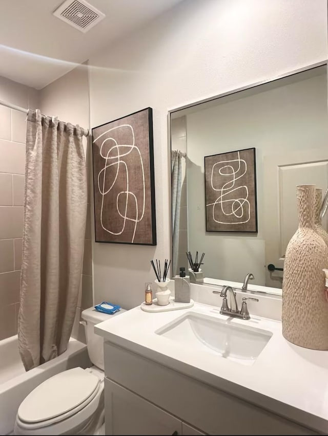 full bathroom with toilet, vanity, and shower / bath combination with curtain