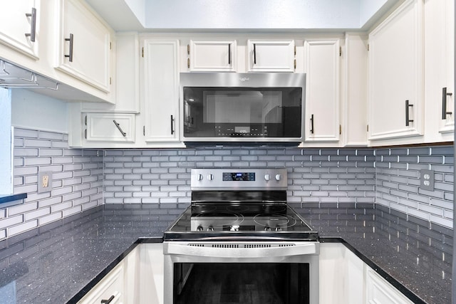 kitchen with stainless steel appliances, decorative backsplash, and white cabinets