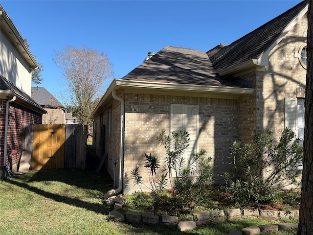 view of home's exterior featuring a yard