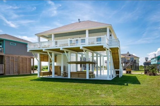 rear view of property with a lawn and a wooden deck