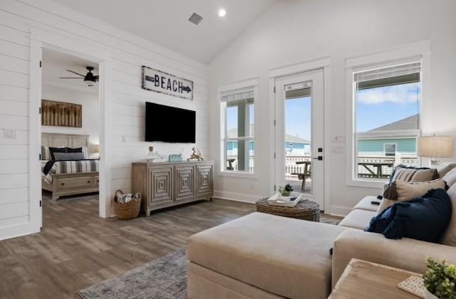 living area featuring wood finished floors, a ceiling fan, high vaulted ceiling, baseboards, and recessed lighting