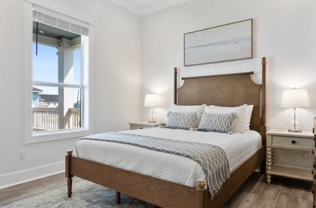 bedroom featuring dark hardwood / wood-style flooring