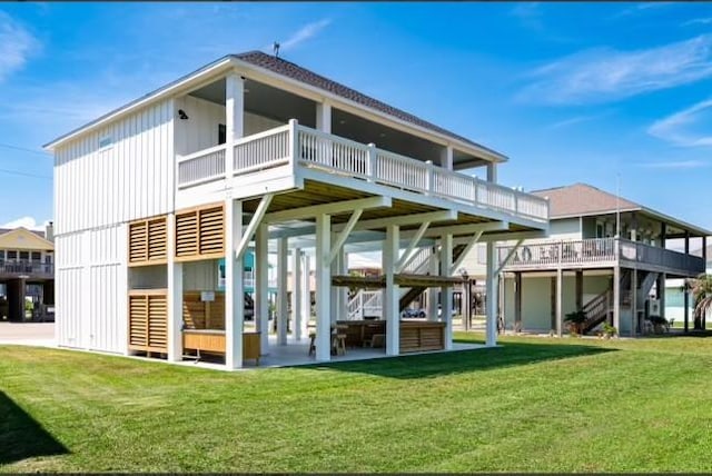 back of house with a yard and board and batten siding