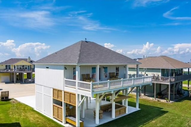 back of property featuring a patio area, a lawn, and central AC