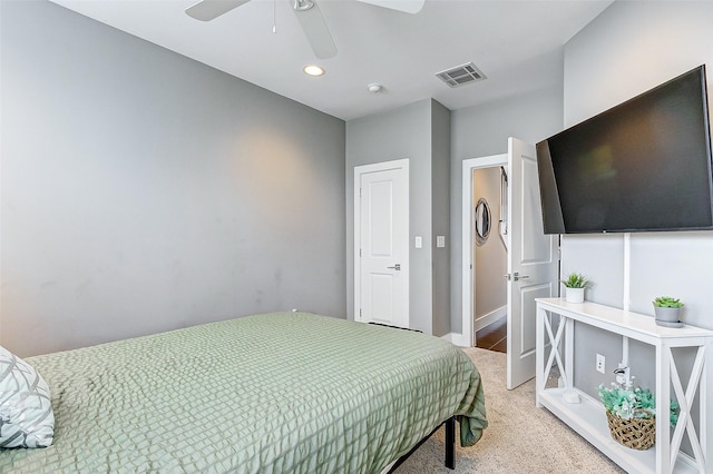 bedroom featuring ceiling fan and light carpet