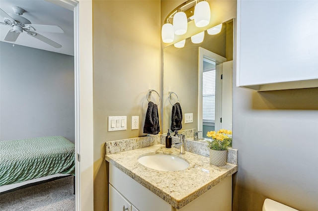 bathroom with ceiling fan and vanity