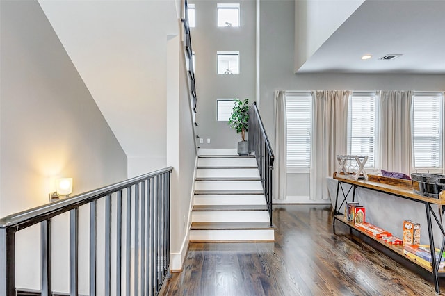 stairway featuring hardwood / wood-style flooring