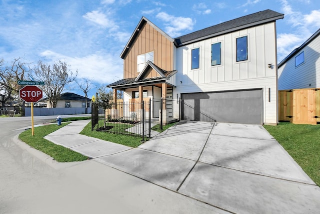 modern farmhouse featuring concrete driveway, a standing seam roof, fence, board and batten siding, and a garage