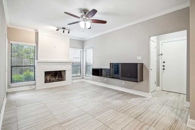 unfurnished living room with ornamental molding, a healthy amount of sunlight, and ceiling fan