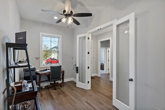 home office with ceiling fan, hardwood / wood-style floors, and french doors