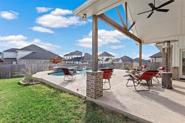 view of patio / terrace featuring a fenced in pool and ceiling fan