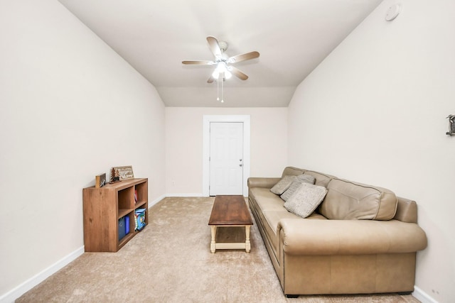 living room featuring ceiling fan, carpet flooring, and vaulted ceiling